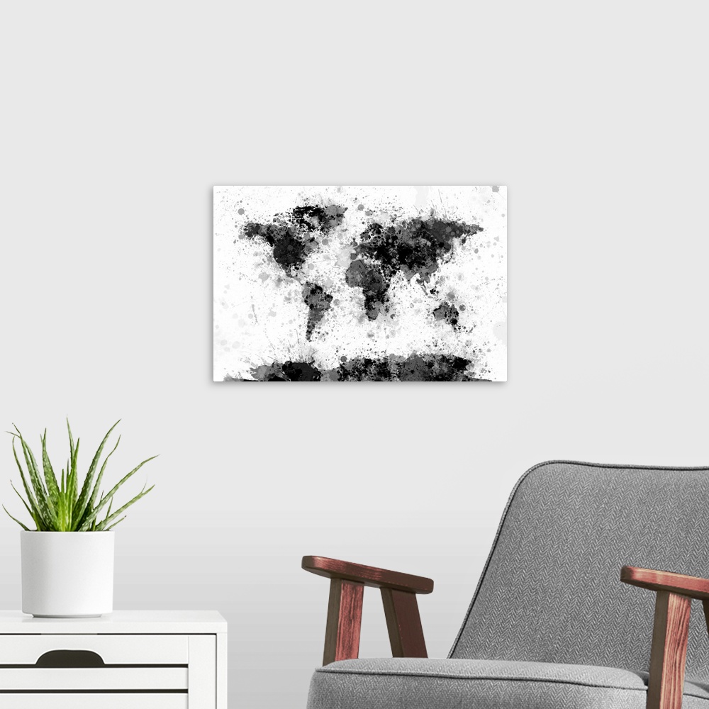 A modern room featuring Contemporary artwork of a world map made from black and gray toned paint splatters.