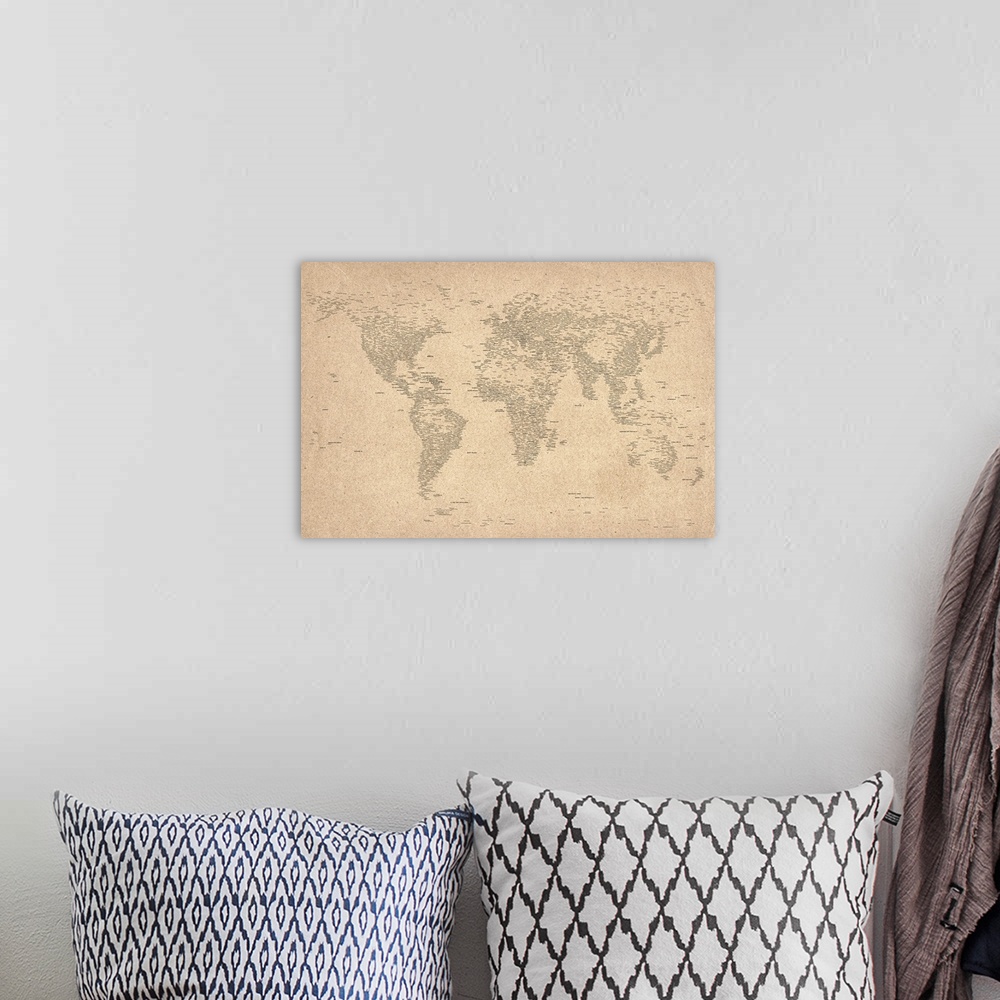 A bohemian room featuring Large, horizontal wall art of the map of the world with each country name spelled out in text.