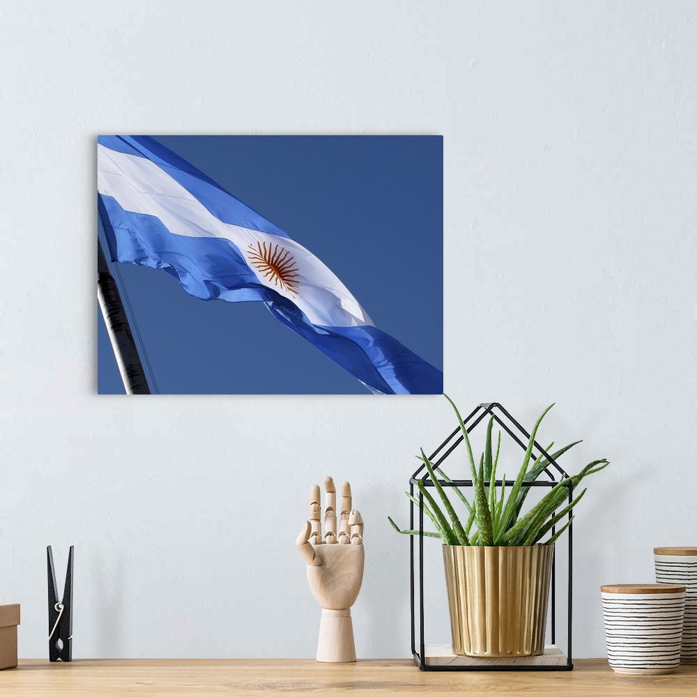 A bohemian room featuring the Argentine flag
