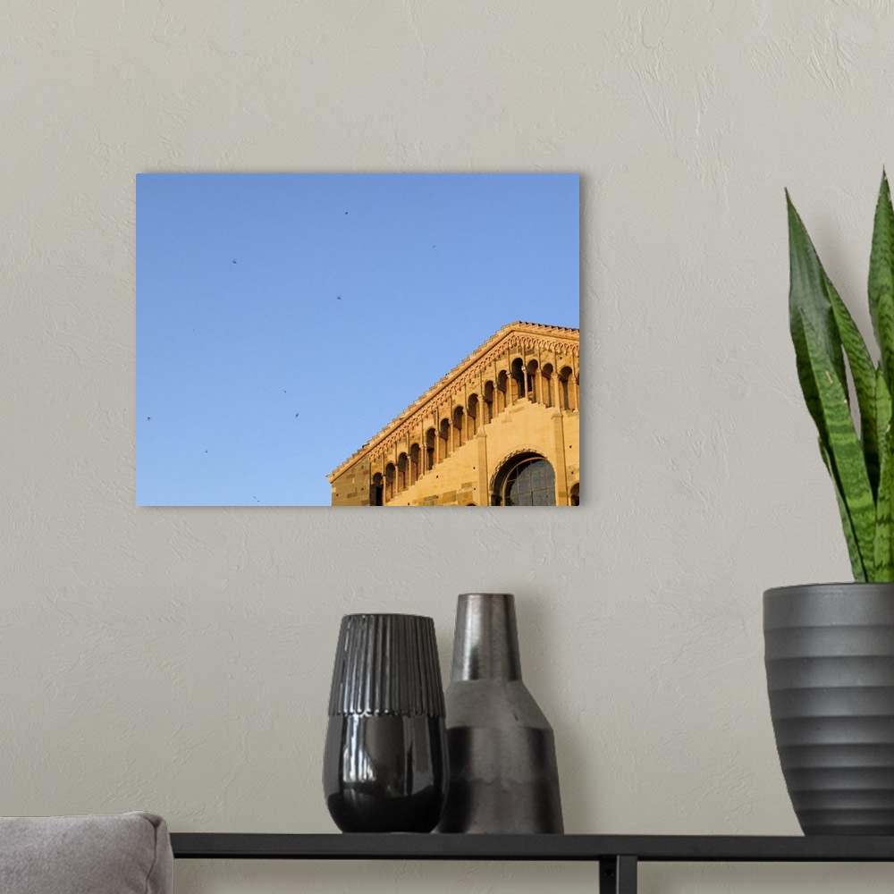 A modern room featuring Close-up of the Duomo facade, built in romanesque architecture style.

Parma is a lovely city i...