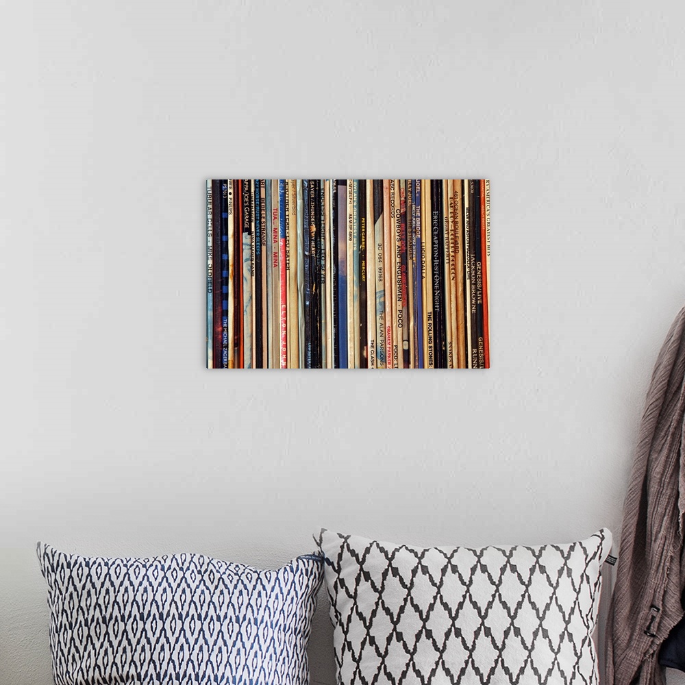A bohemian room featuring Big photograph shows a large collection of LP vinyl records that includes works from artists such...