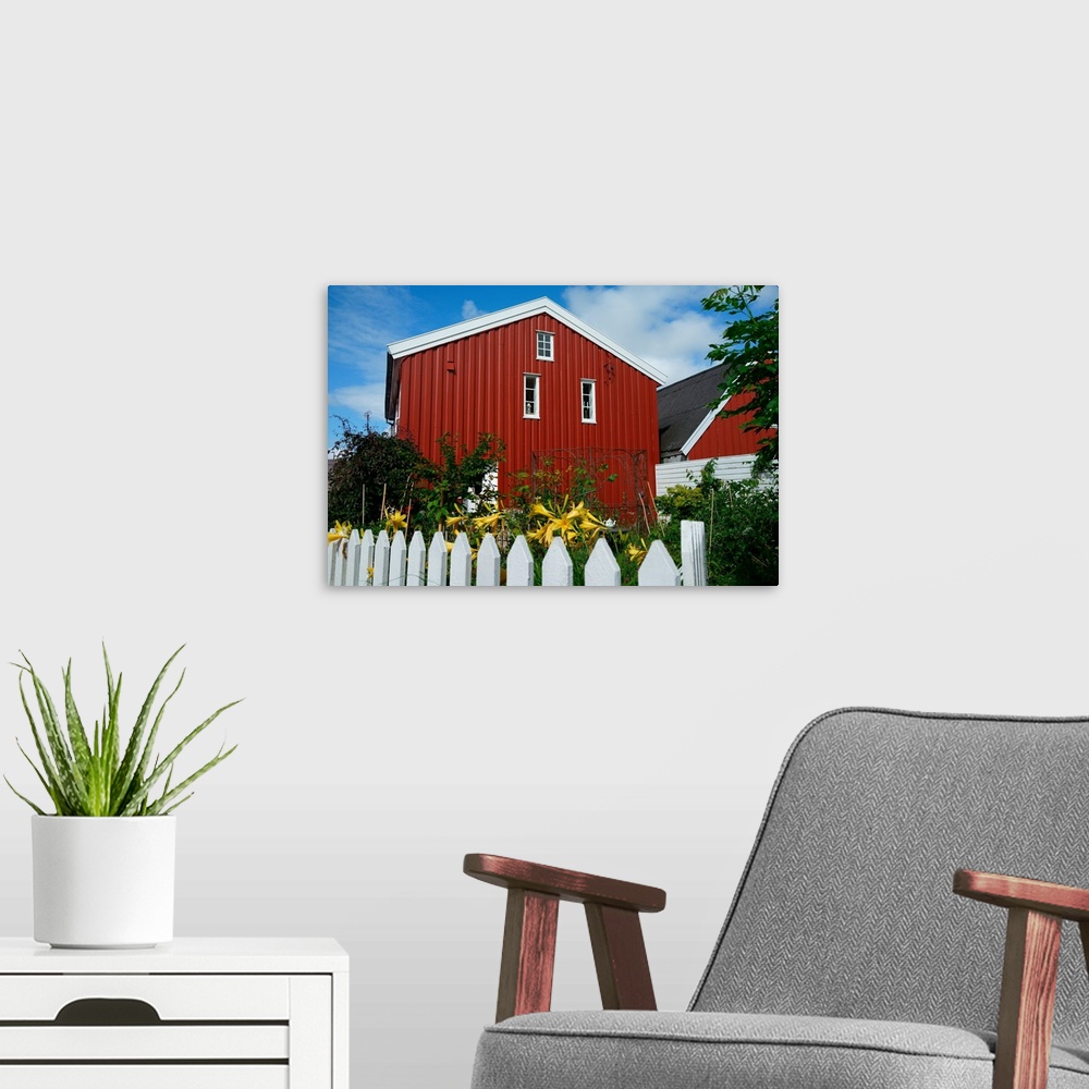 A modern room featuring Norway, Skudeneshavn: red house and white fence