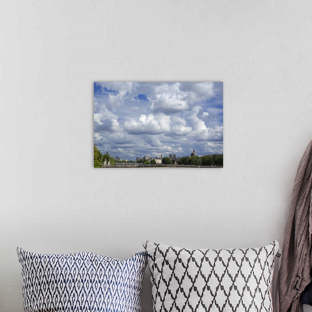 A bohemian room featuring Paris skyline under a cloudy sky