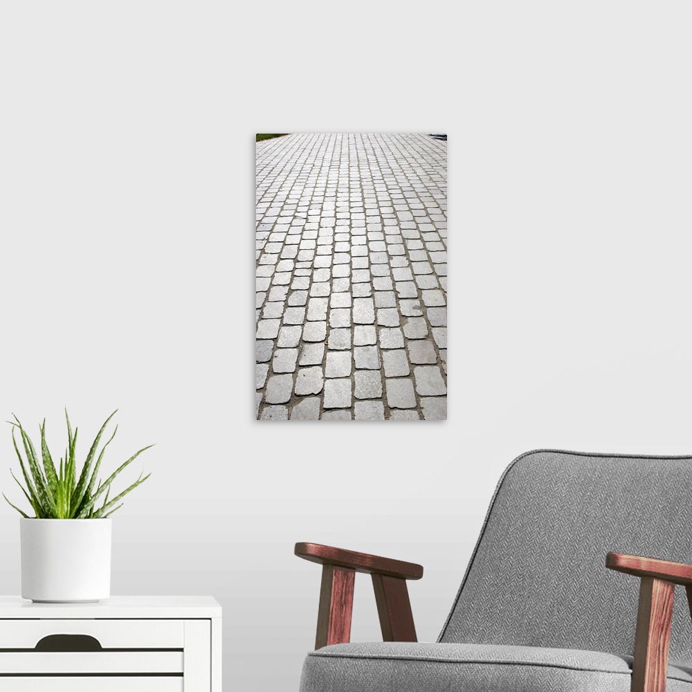 A modern room featuring Paris, France. Original street pavement in stone bricks