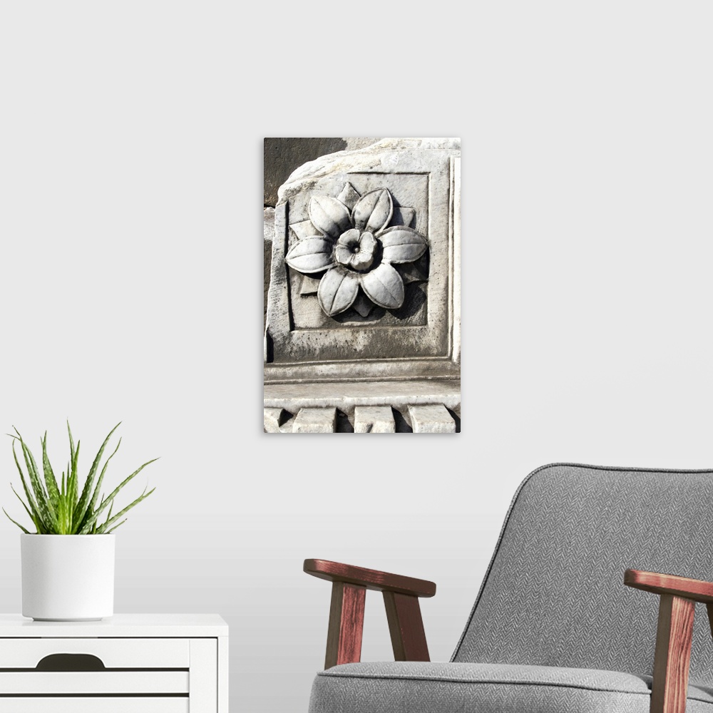 A modern room featuring Marble, travertine, decoration representing a flower. Follen to the ground from arch or temple ce...
