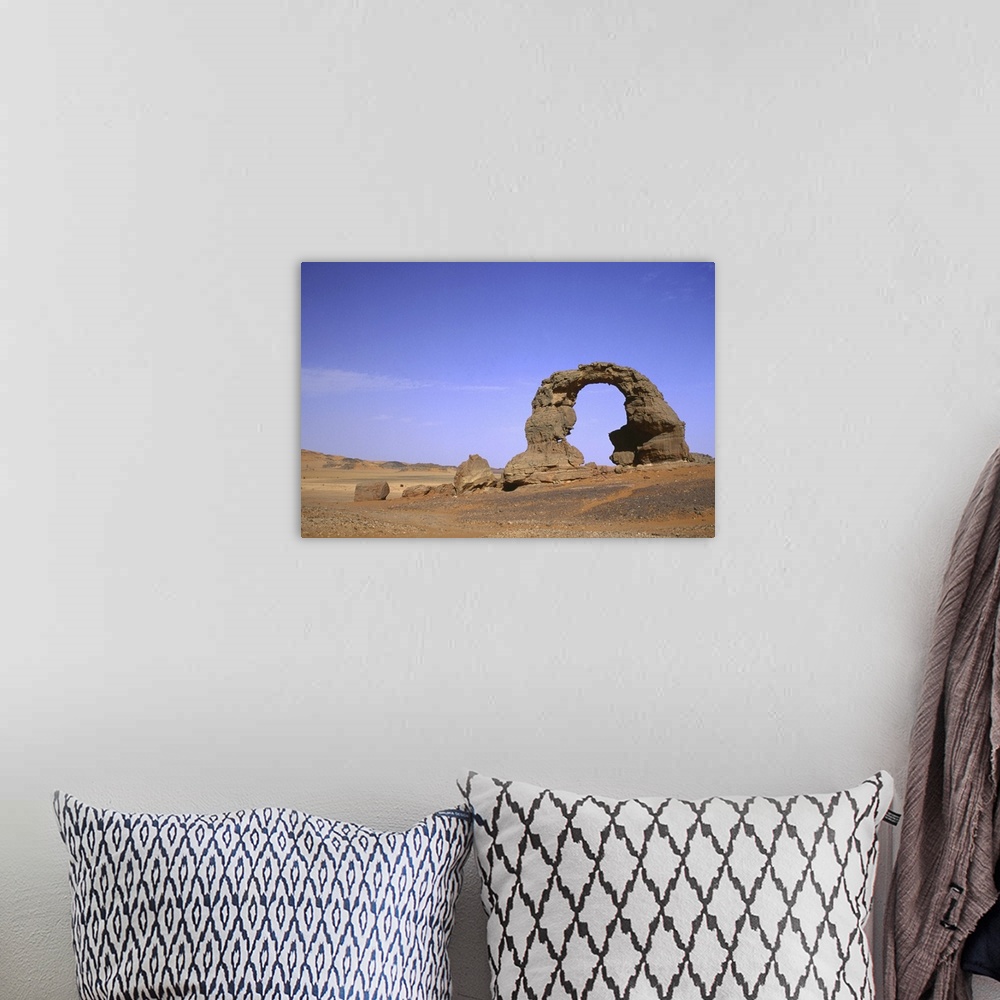 A bohemian room featuring Algeria, Ahaggar mountains, stone arch