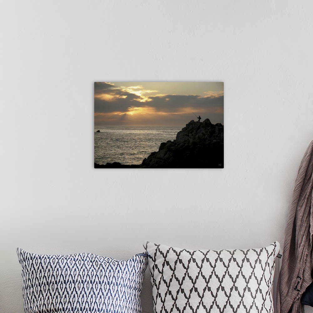 A bohemian room featuring A fisherman casts his line at sunset in Pacific Grove, California, in this alluring piece of artw...