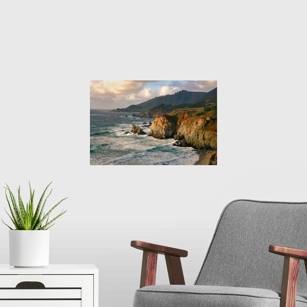 A modern room featuring The ocean meets a spectacular rock formation near Rocky Creek Bridge in Big Sur, and the teals an...