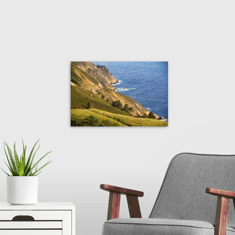 A modern room featuring A view from the mountains of Big Sur, of Highway One and the ocean below. Acclaimed artist Michae...