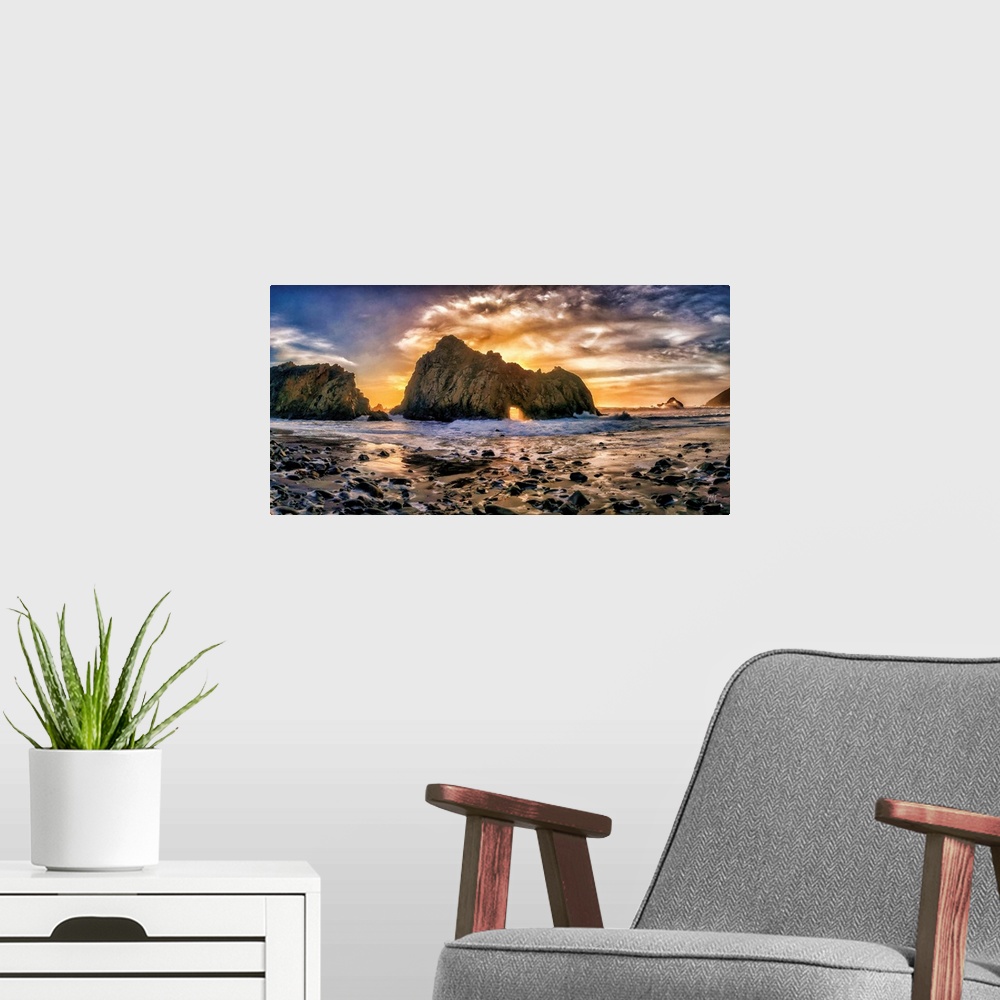 A modern room featuring Rays from the setting sun light up the sky and shine a spotlight through the famed "Keyhole" rock...