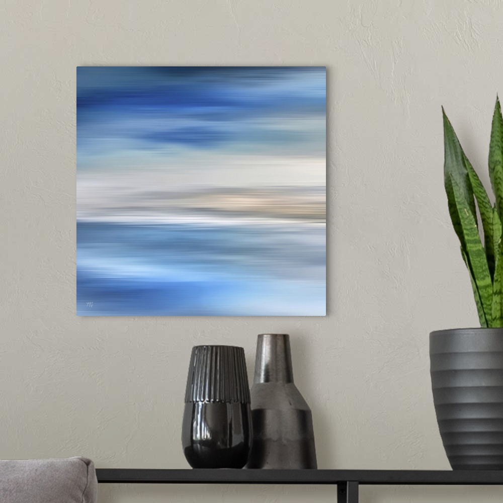 A modern room featuring The soothing blues and relaxing sandy tones of a Carmel ocean scene will brighten any room.