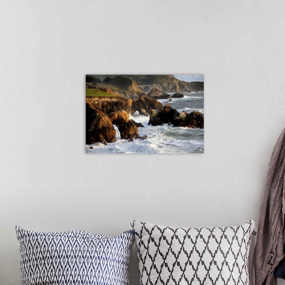 A bohemian room featuring A spectacular view of the rugged coastline in Big Sur with the Rocky Creek Bridge in the distance...