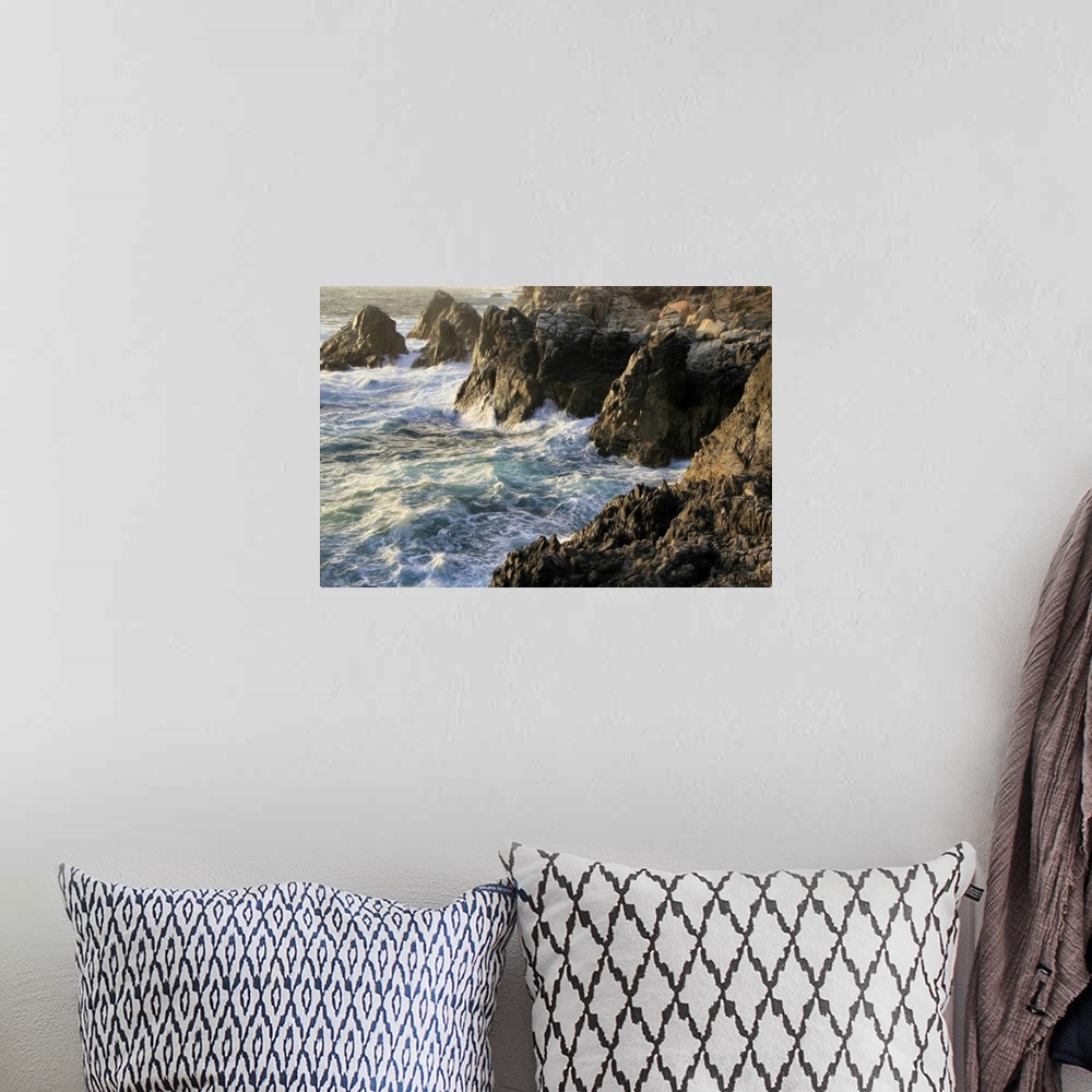 A bohemian room featuring Lying chest down on a rocky cliff about 40 feet above crashing waves, Michael Lynberg captured th...