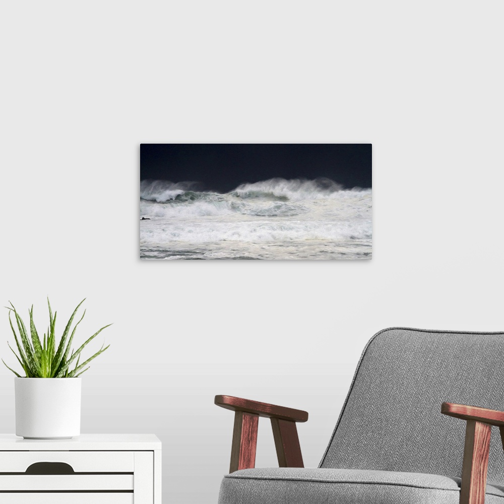 A modern room featuring Large waves crash toward the shore in Pebble Beach with storm clouds darkening the sky behind the...
