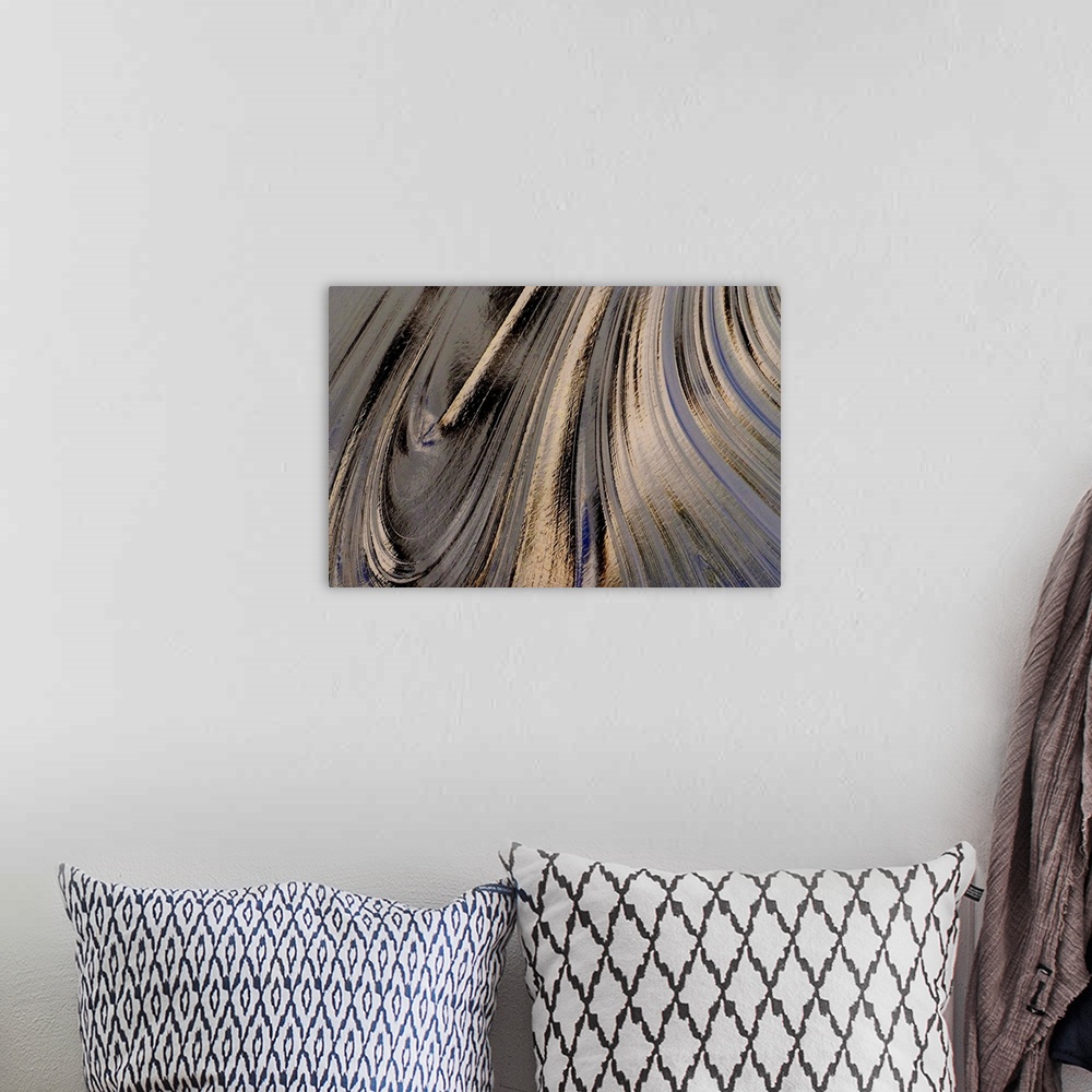 A bohemian room featuring A close up nature photograph of a light reflecting off oil creating abstract swirling movement.