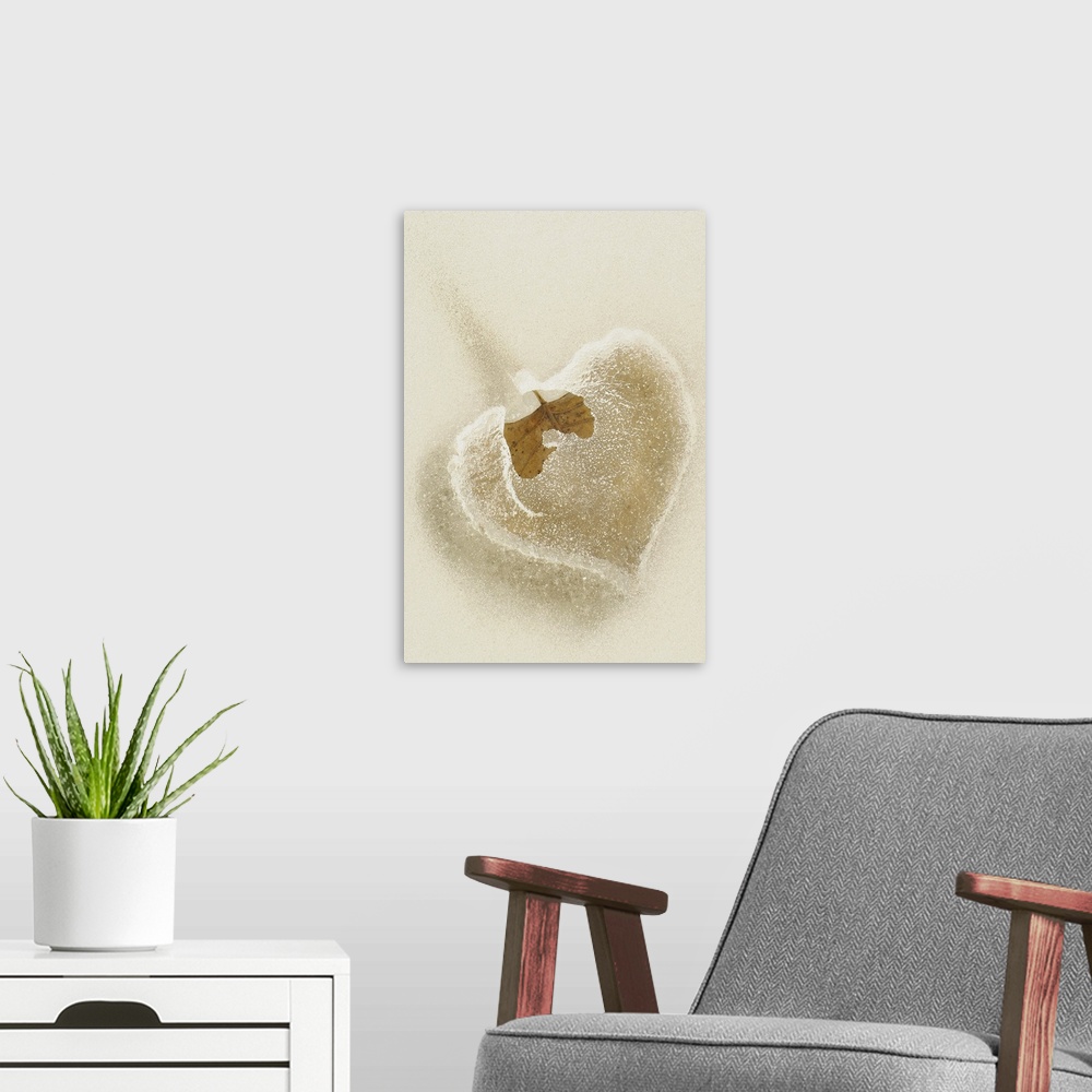 A modern room featuring This vertical wall hanging is a close up photograph of a leaf trapped in frozen water.
