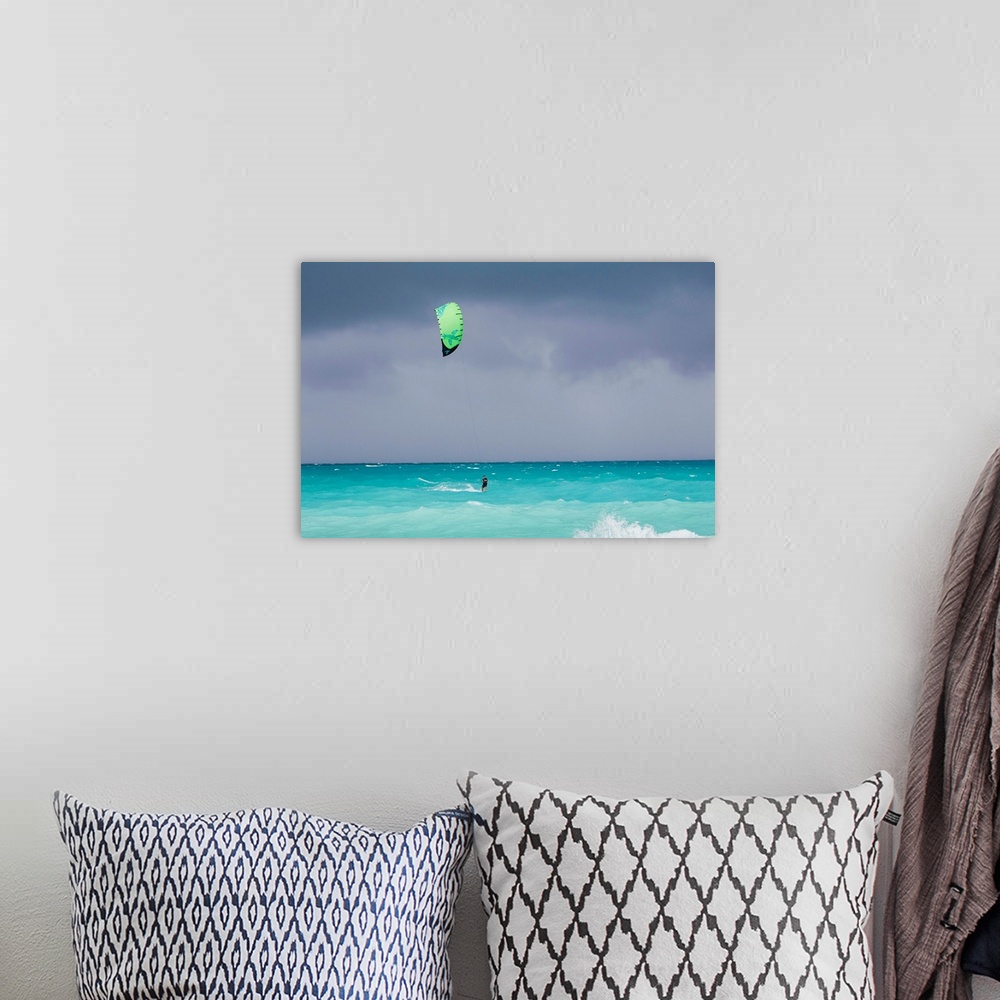 A bohemian room featuring A kiteboarder enjoying gusty winds created by Hurricane Tomas.