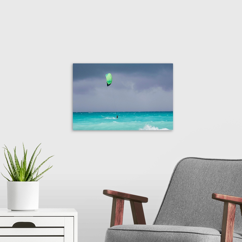 A modern room featuring A kiteboarder enjoying gusty winds created by Hurricane Tomas.