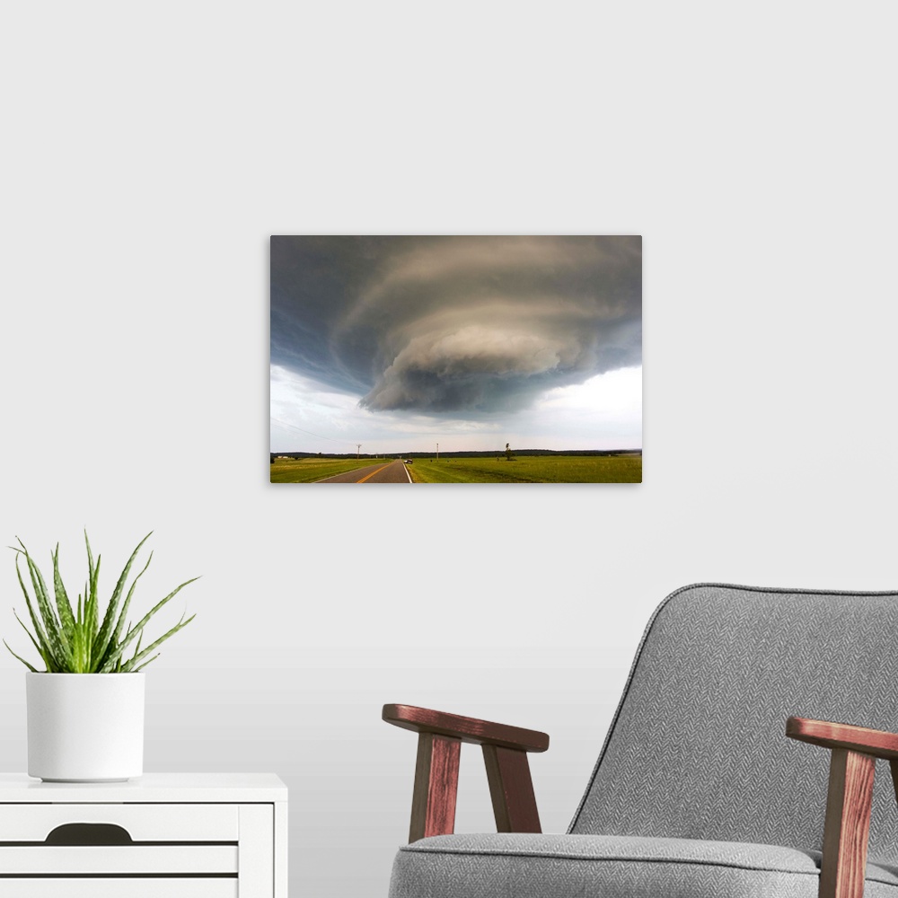 A modern room featuring A rotating supercell thunderstorm and wall cloud.