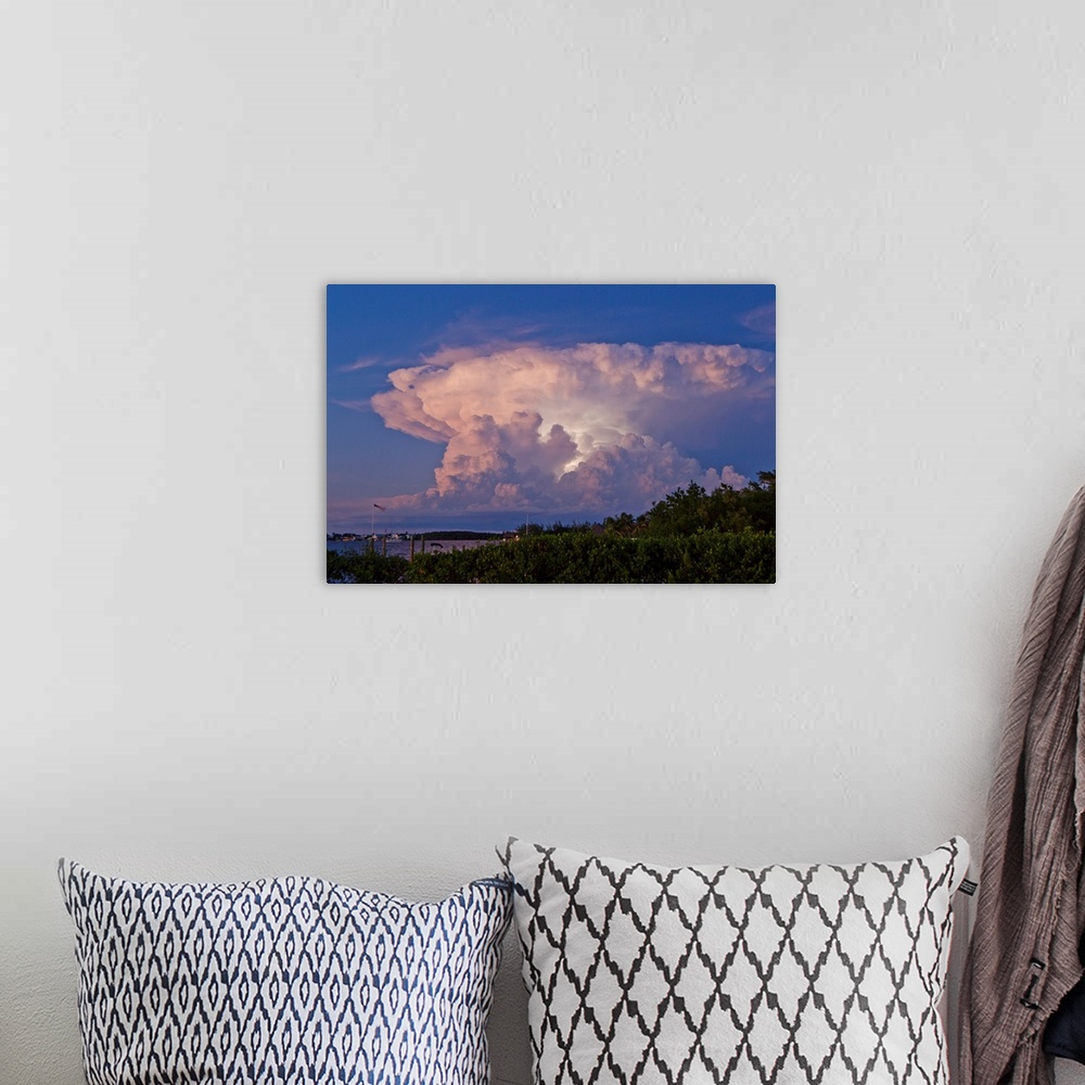A bohemian room featuring A supercell anvil cloud filled with discharging electricity.