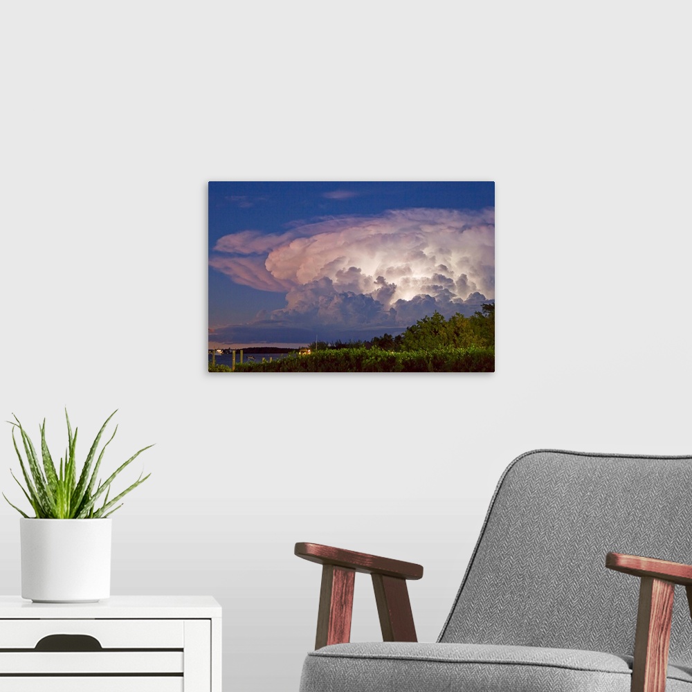 A modern room featuring A supercell anvil cloud filled with discharging electricity.