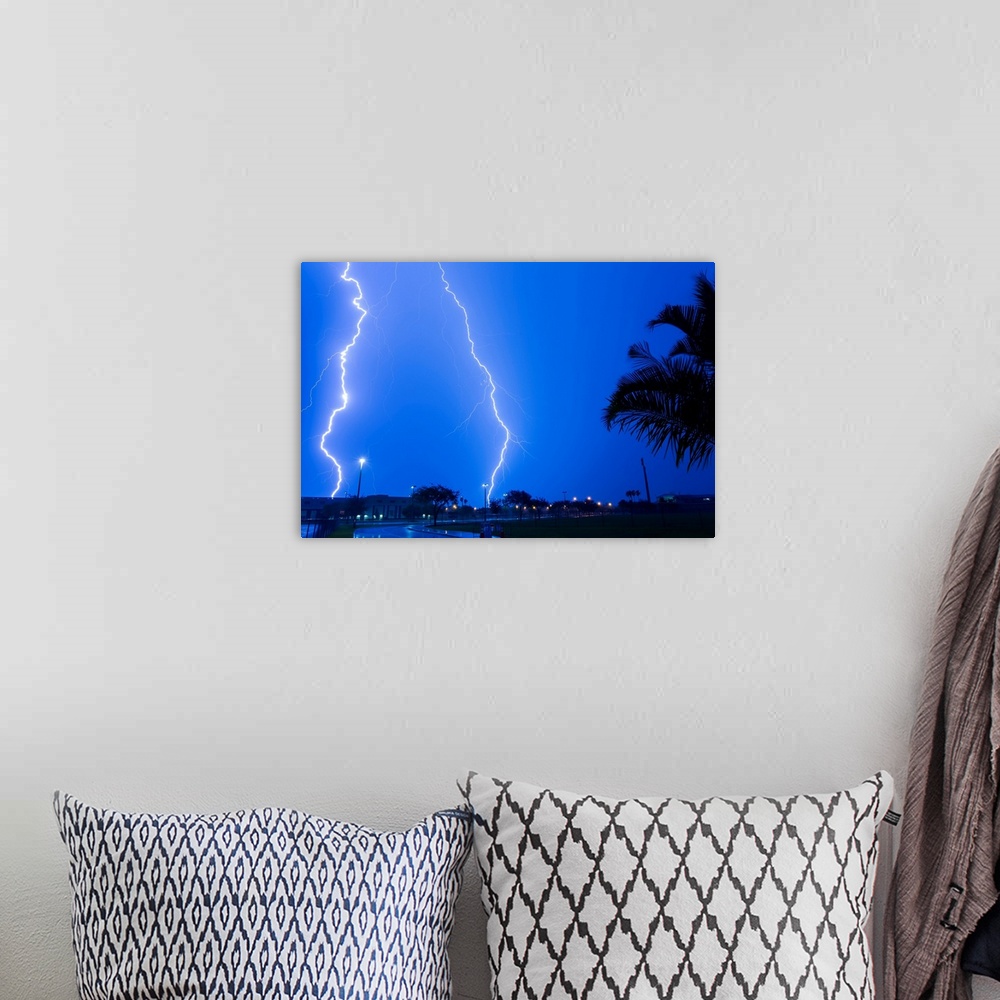 A bohemian room featuring A supercharged lightning storm spitting out numerous lightning bolts at the same time in Homestea...