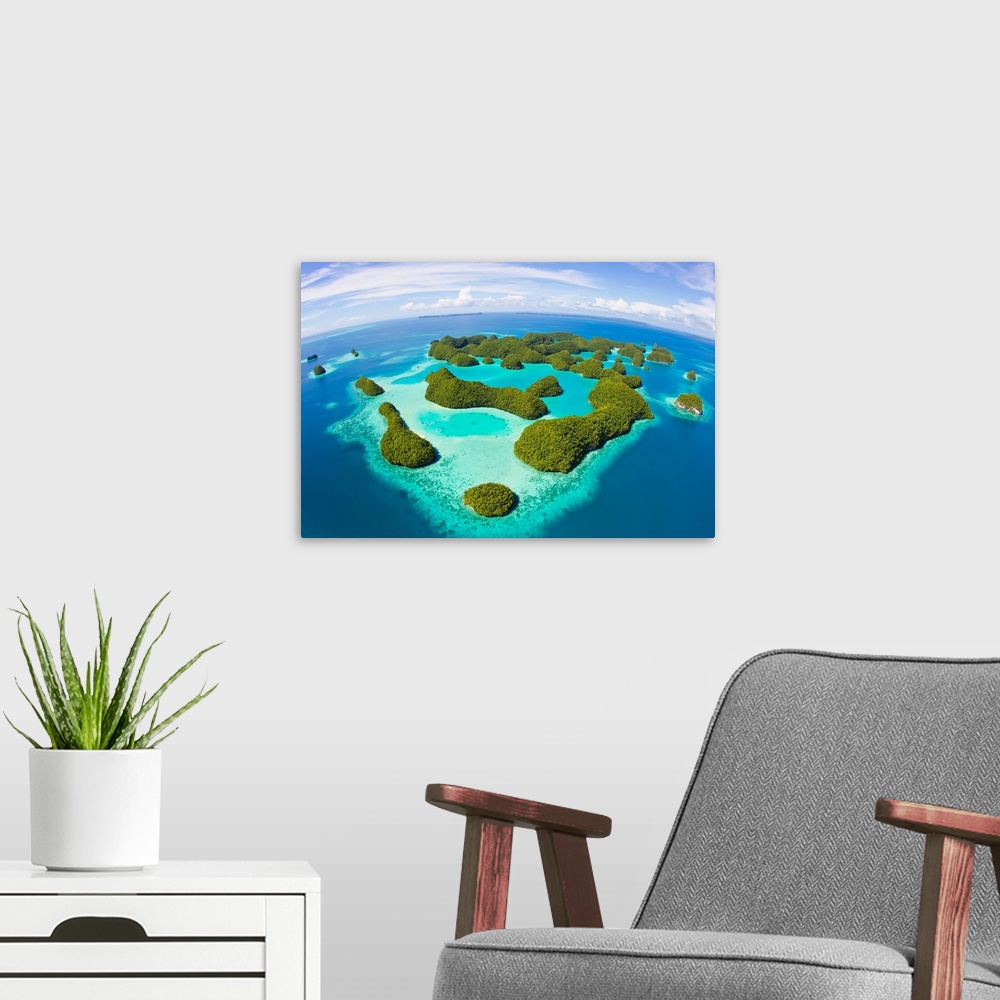 A modern room featuring An aerial fisheye lens view of Palau's Rock Islands in the turquoise waters of the Pacific Ocean.
