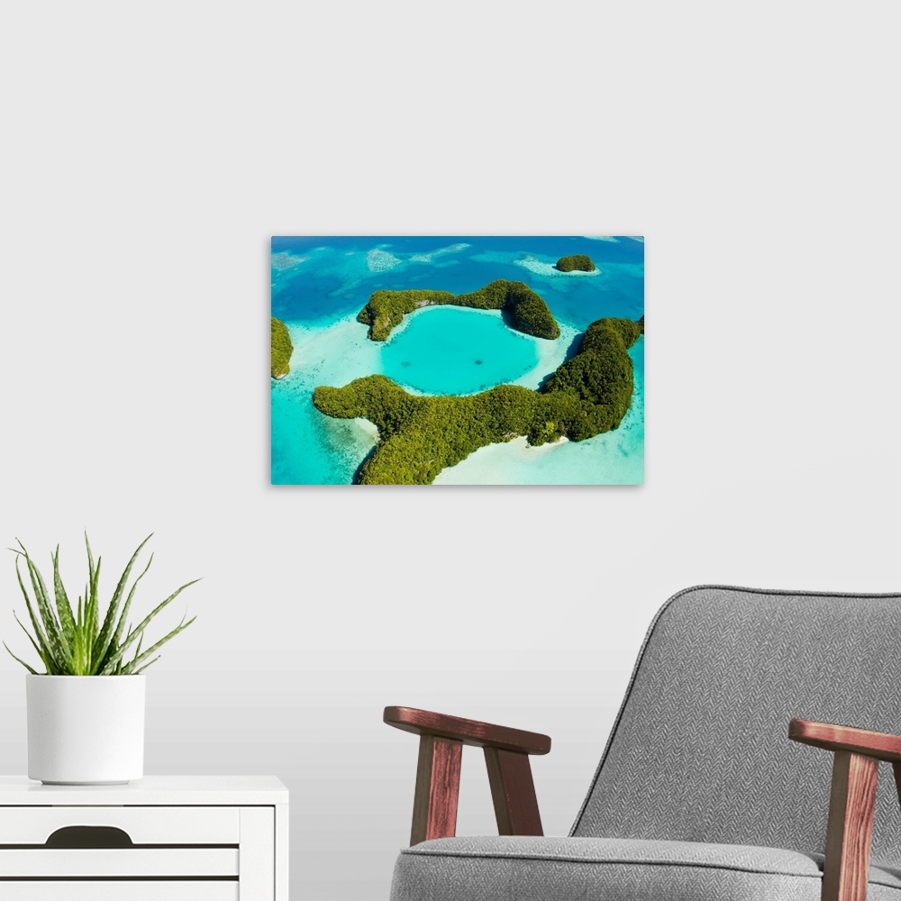 A modern room featuring An aerial view of Palau's Rock Islands in the turquoise waters of the Pacific Ocean.