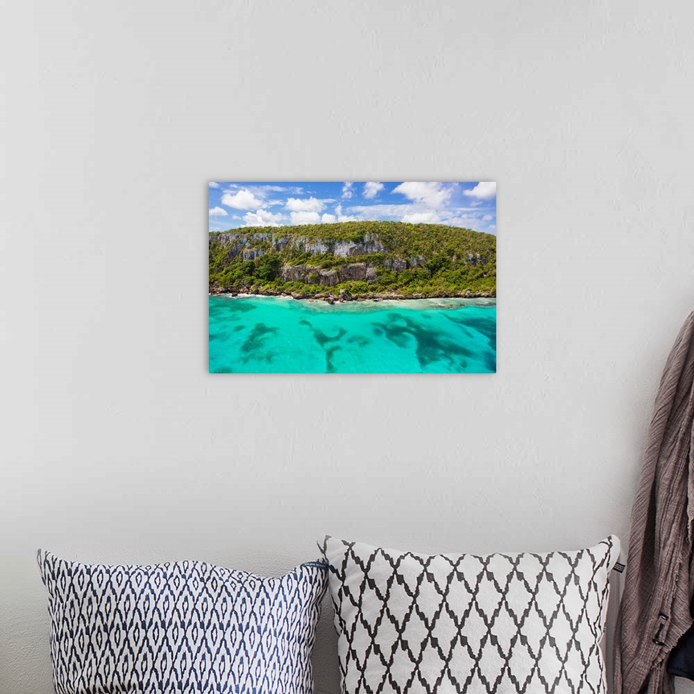 A bohemian room featuring An aerial view of tall cliffs and turquoise water on the north coast of Jamaica.