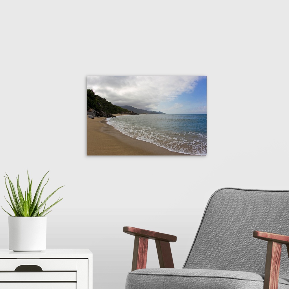 A modern room featuring Clouds and surf rolls in at a tropical beach.