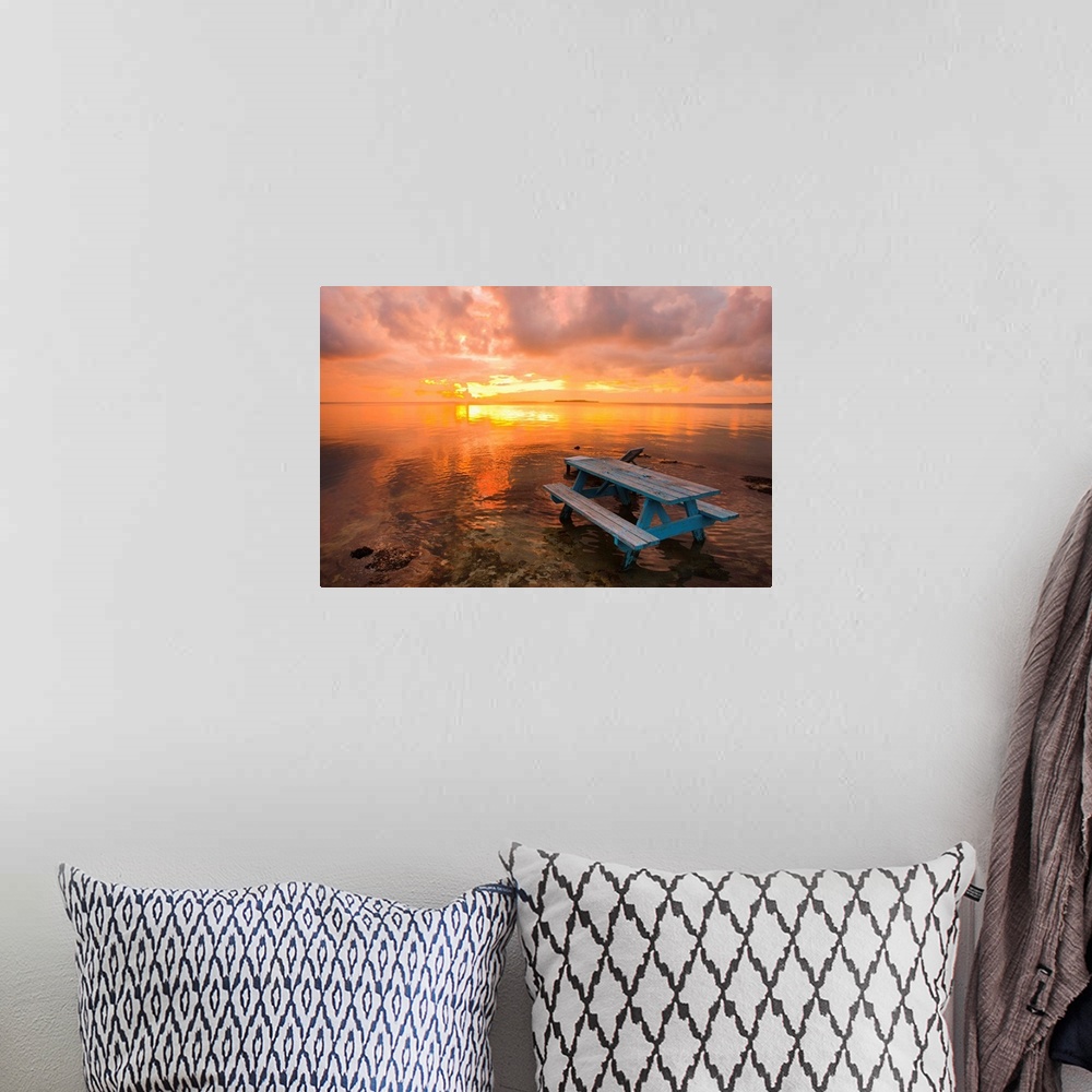 A bohemian room featuring Cumulus cloud set up and threaten to produce a waterspout at sunset.