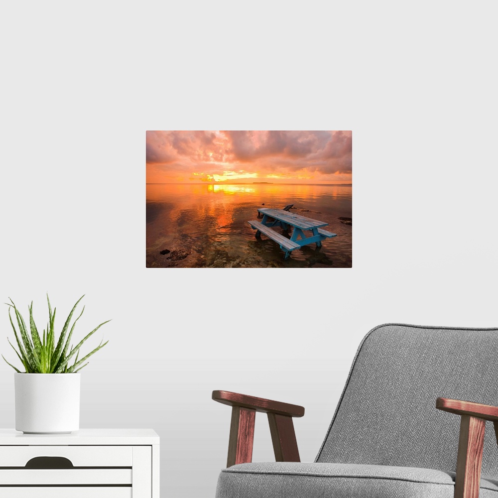 A modern room featuring Cumulus cloud set up and threaten to produce a waterspout at sunset.