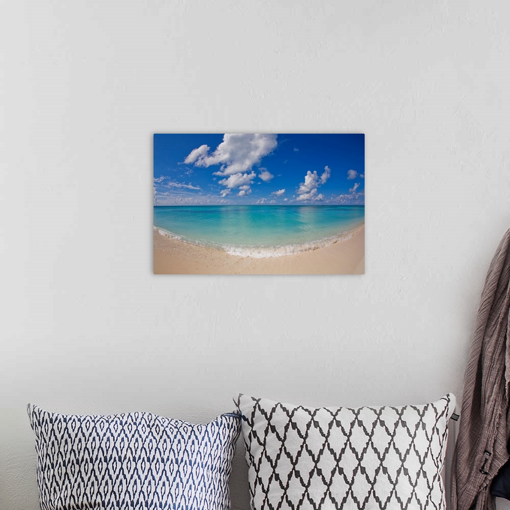 A bohemian room featuring Perfect beach day with blue skies, clear water, puffy white clouds.