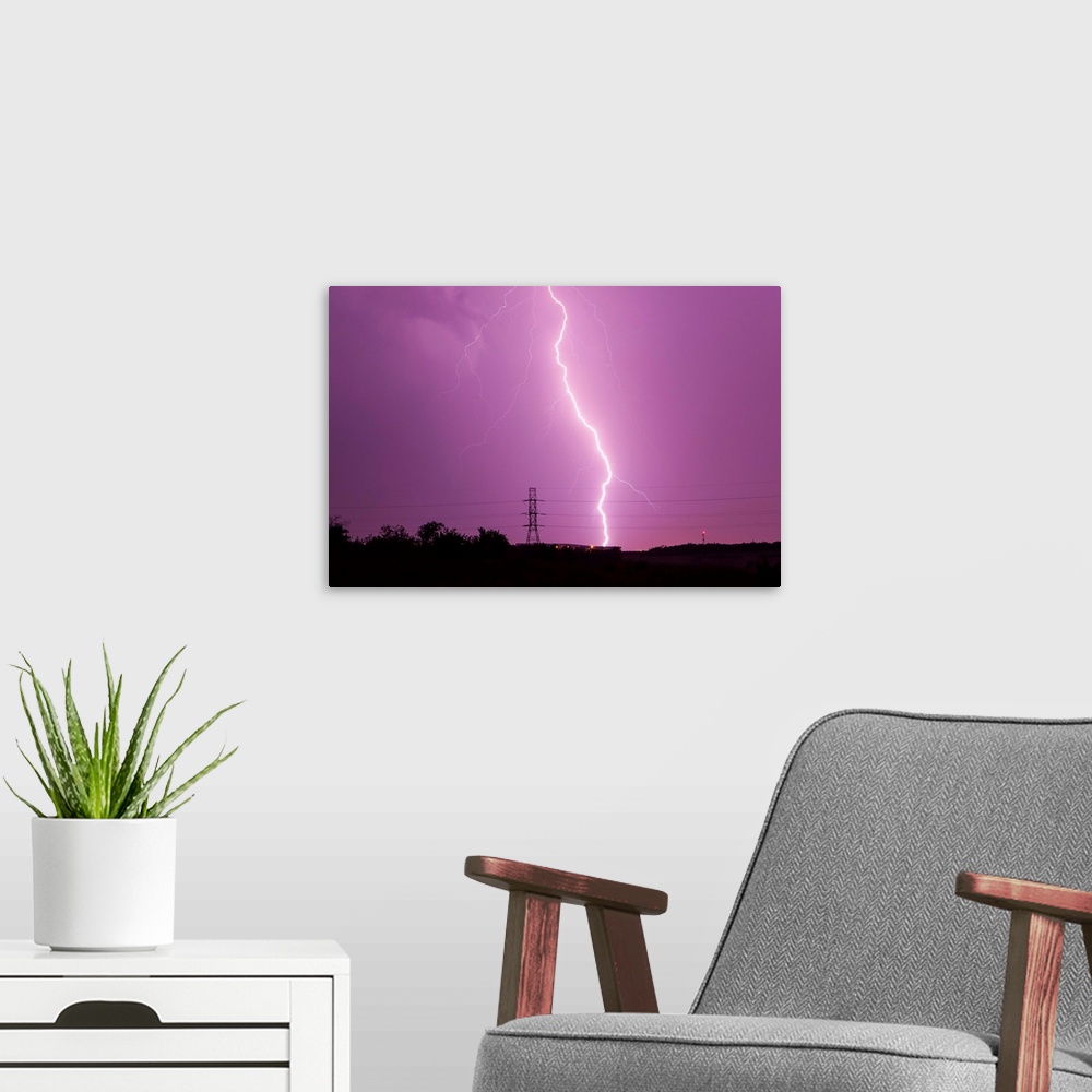 A modern room featuring Intense lightning bolt strikes in the city of Dallas during an active lightning storm in Texas.