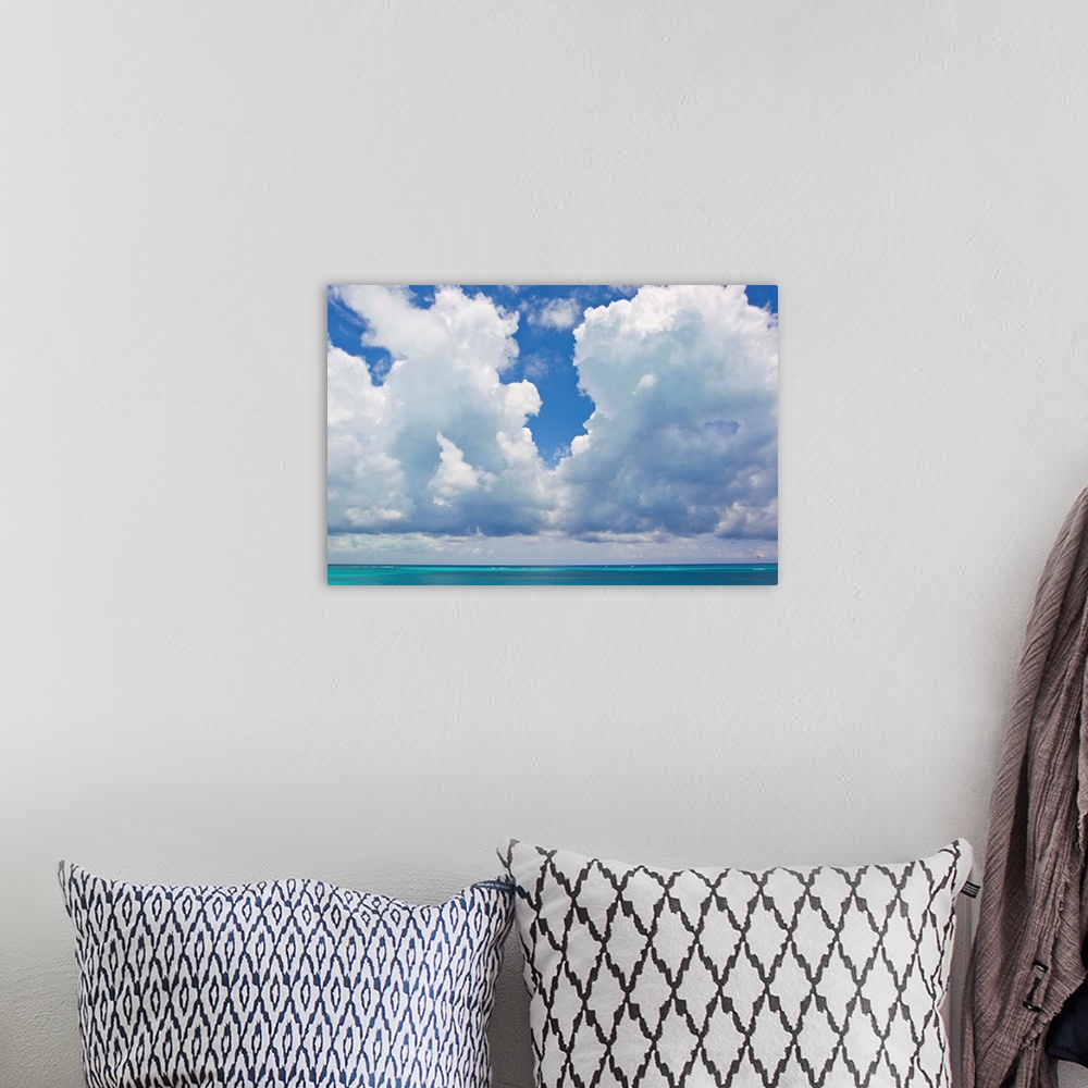 A bohemian room featuring Large clouds over Grace Bay, in the Turks and Caicos Islands.