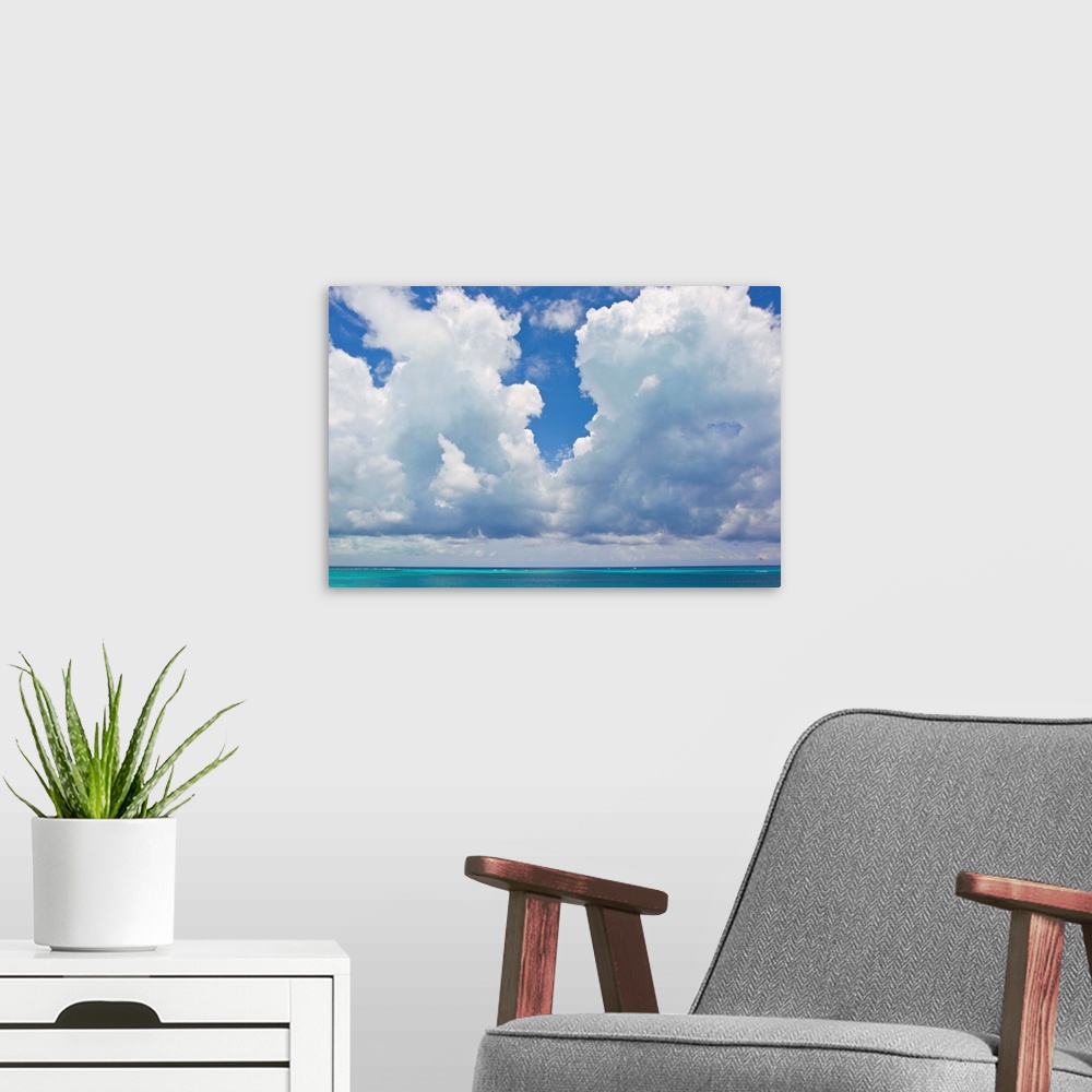 A modern room featuring Large clouds over Grace Bay, in the Turks and Caicos Islands.