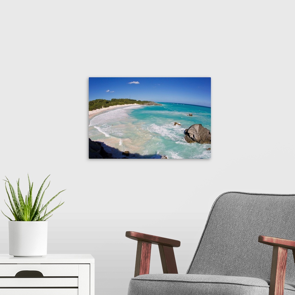 A modern room featuring Large surf and coastal rocks at Horseshoe Bay beach.