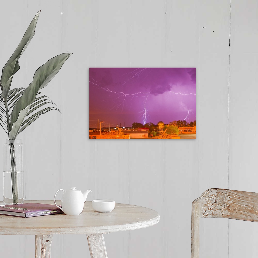 A farmhouse room featuring Multiple lightning bolts during an intense lightning storm.