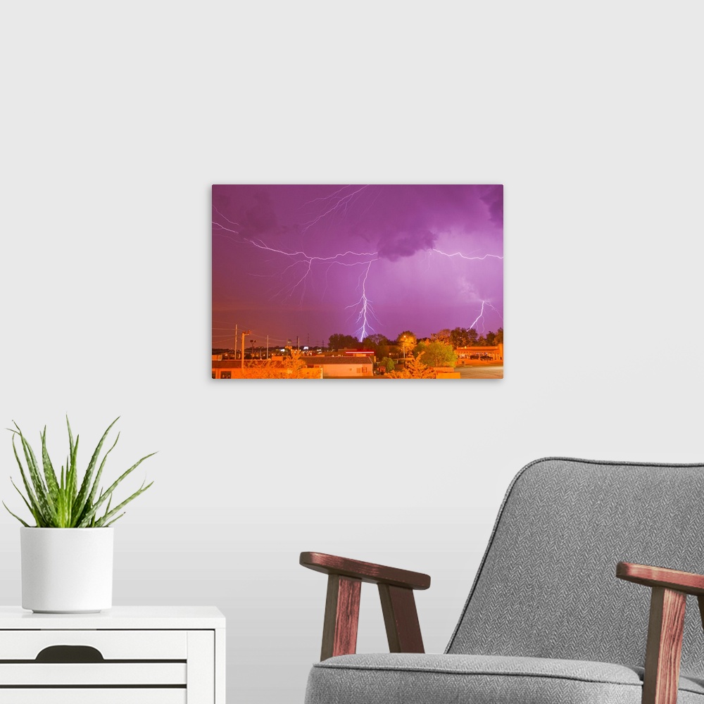 A modern room featuring Multiple lightning bolts during an intense lightning storm.