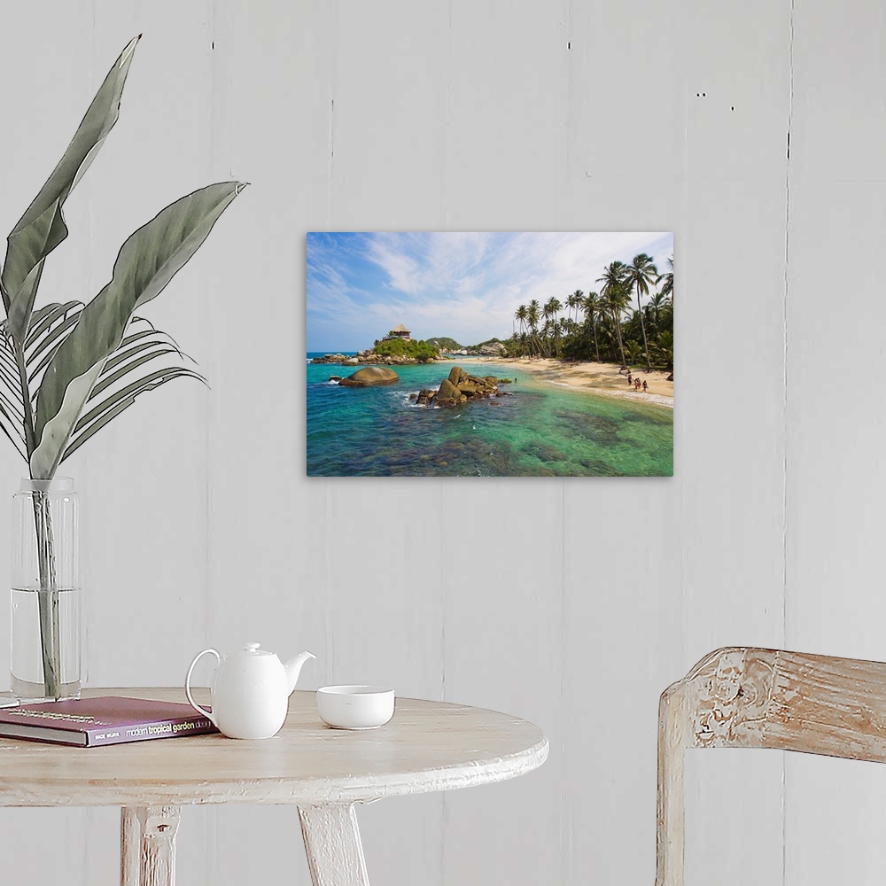 A farmhouse room featuring People on the palm tree-lined tropical beach at Cabo San Juan.