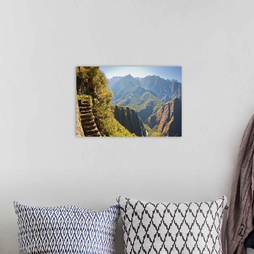 A bohemian room featuring Steep stairs on a mountain side on the Inca trail at Machu Picchu.
