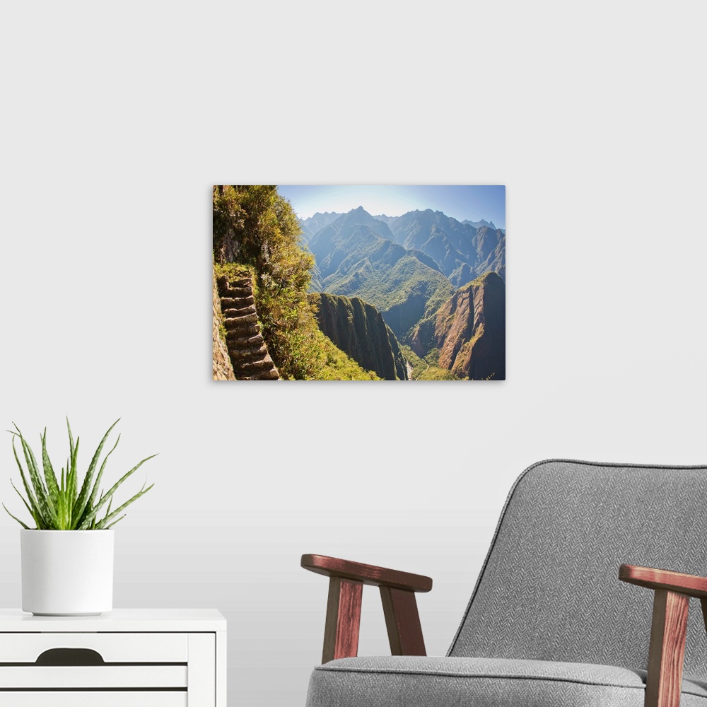 A modern room featuring Steep stairs on a mountain side on the Inca trail at Machu Picchu.
