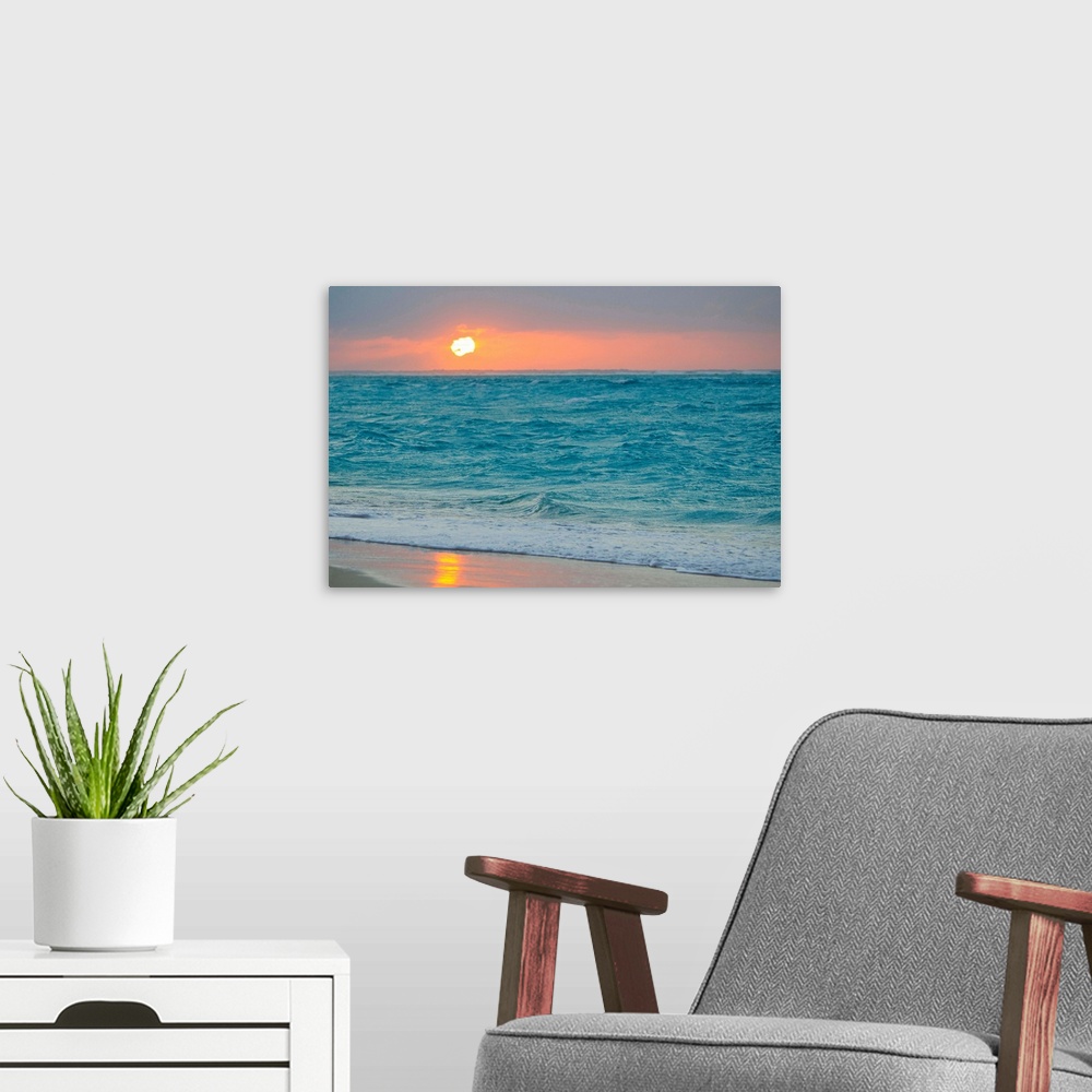 A modern room featuring From the National Geographic Collection, a photo canvas of choppy ocean waves crashing onto a tro...