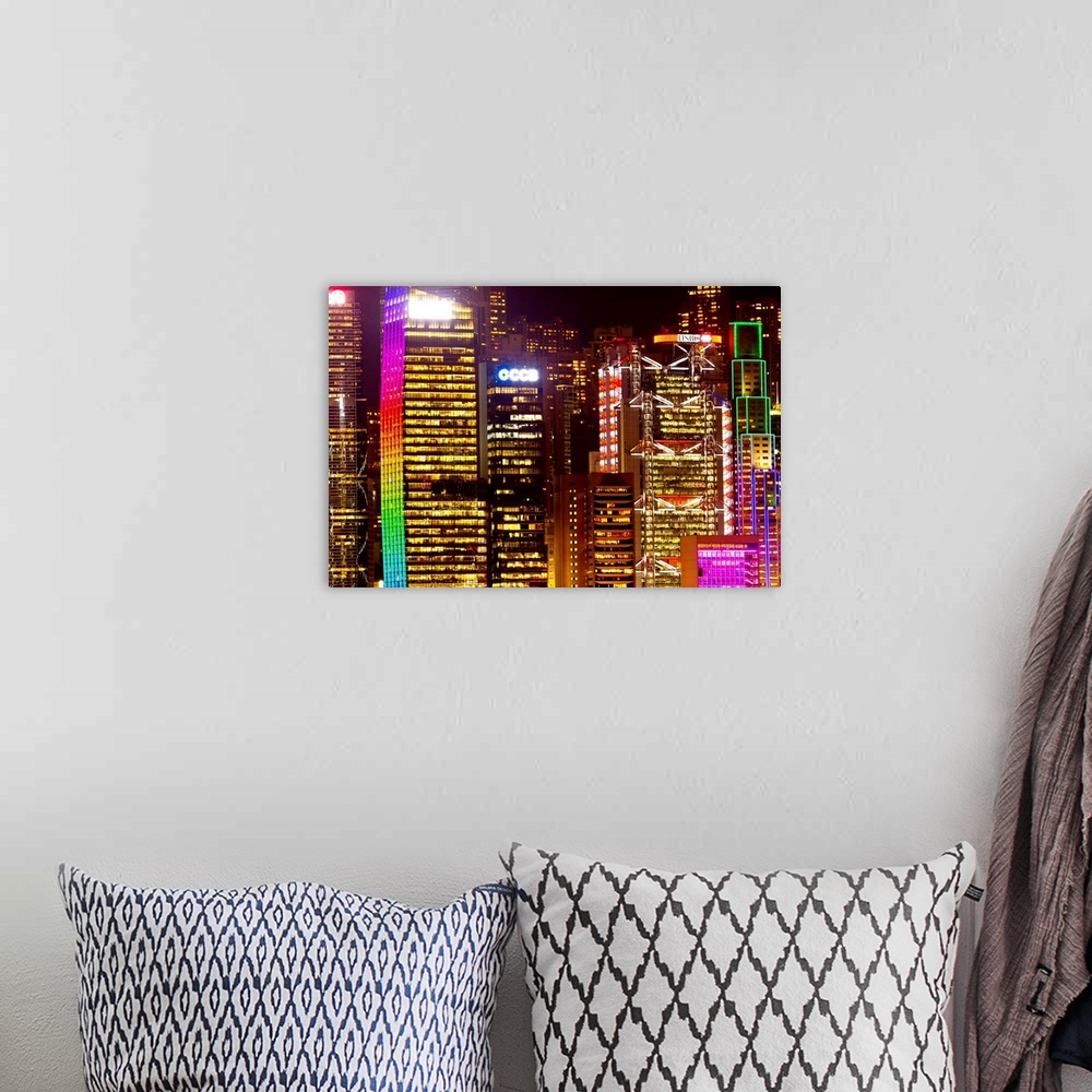 A bohemian room featuring The colorful Hong Kong skyline completely lit up at night.
