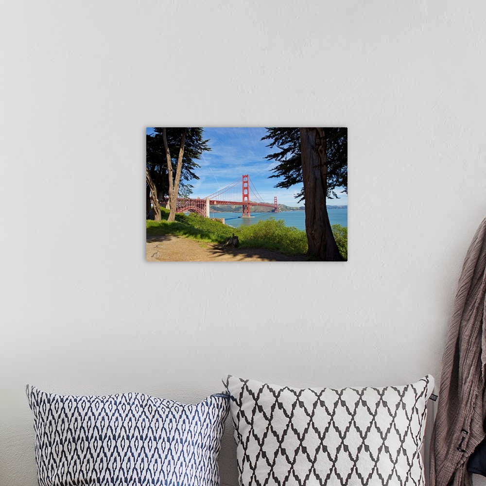 A bohemian room featuring The Golden Gate Bridge viewed from a nearby park.