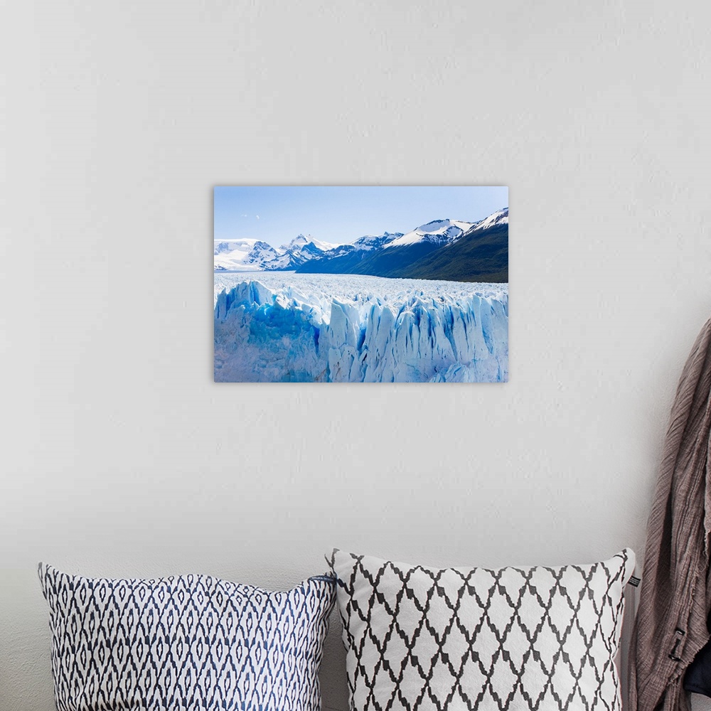 A bohemian room featuring Deep blue cracks line the front wall of the Perito Moreno glacier in Los Glaciares National Park.