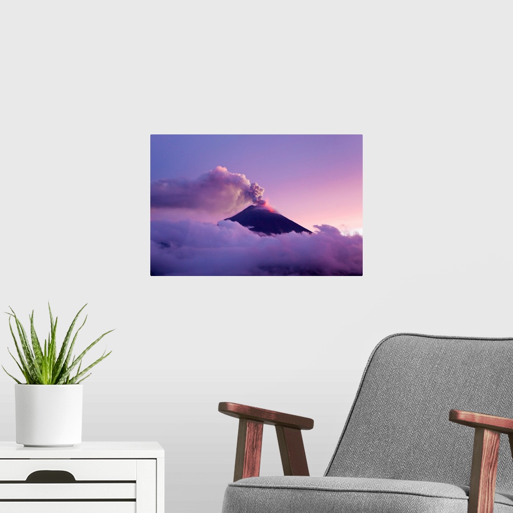 A modern room featuring The Tungurahua volcano erupting at twilight.