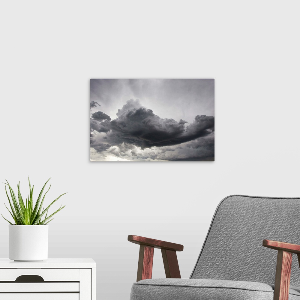 A modern room featuring Underneath a supercell thunderstorm with dark and eerie storm clouds.