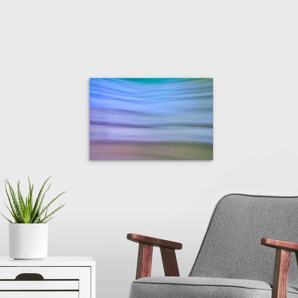 A modern room featuring artistic abstract study of a garden in full blossom in summertime, by using intended camera blurr...