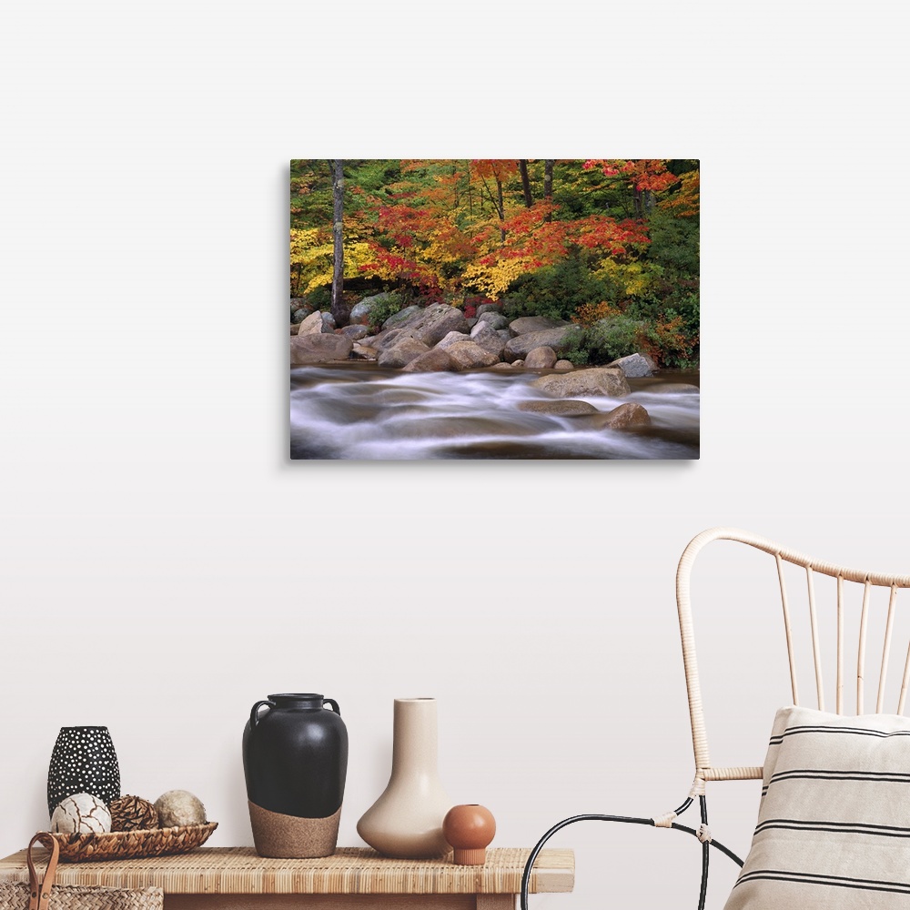A farmhouse room featuring Photograph of rocky stream lined with large rock boulders and forest covered in bright fall foliage.